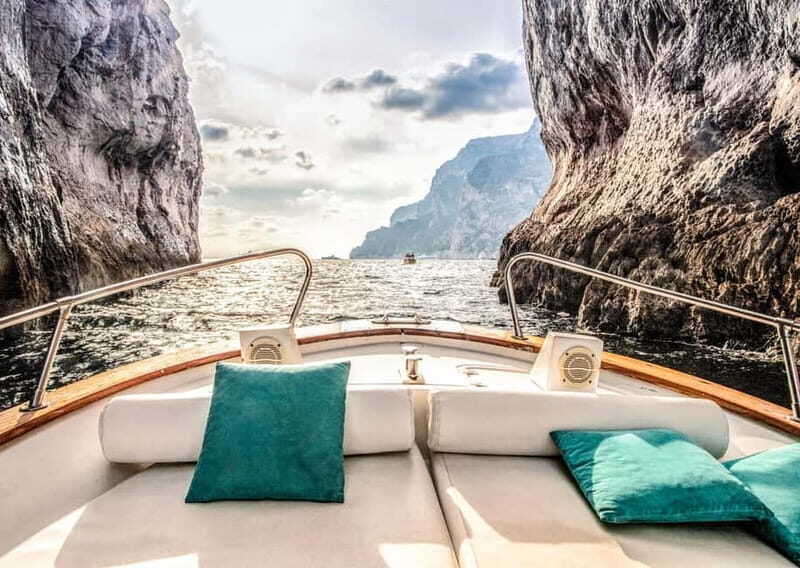Amalfi Coast Shared Sunset Cruise: Swim, Drinks & Views - Sailing from Amalfi toward Positano: caves, arches, and quick stops
