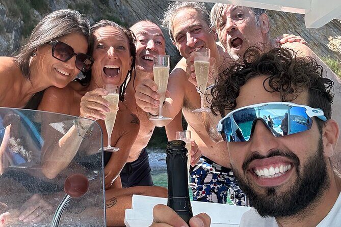 Aperitif on a boat at sunset in Palinuro - Stop 1: Grotte Marine di Capo Palinuro and the Blue Grotto glow
