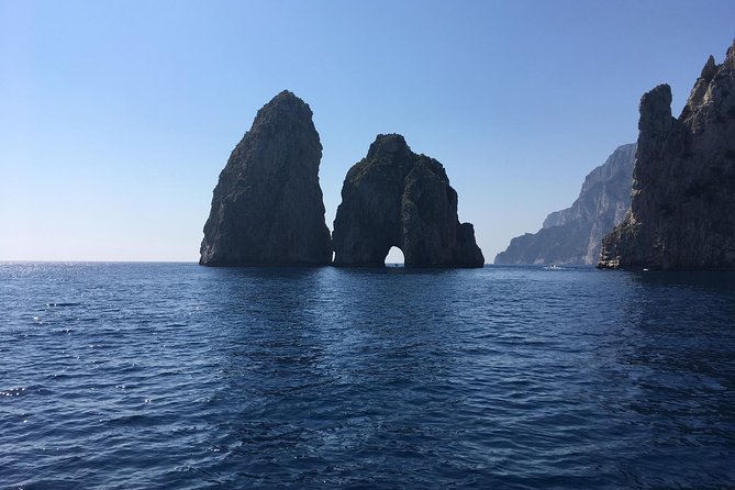 Capri and Blue Grotto by Gozzo Boat and Anacapri from Naples - Faraglioni and the port-area beach time: using the “in-between” well