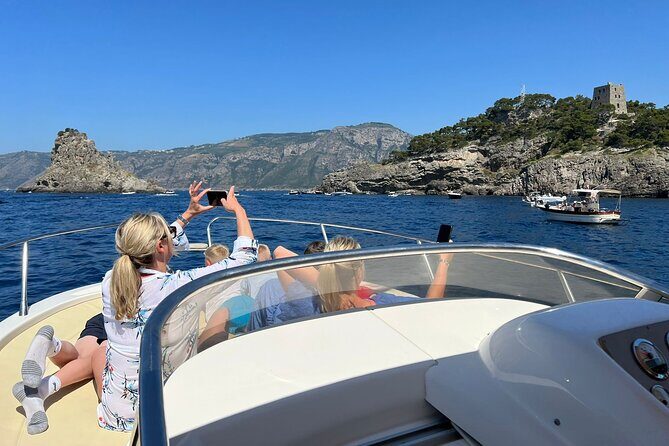 Capri and Blue Grotto Private Boat Tour - Punta Carena at sunset and the Faraglioni photo targets