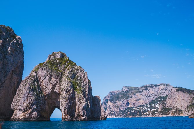 Capri Boat Tour: Grottoes, Swim & Sip Limoncello in a Small Group - The grottos and cliffs: what you’ll actually see on the water