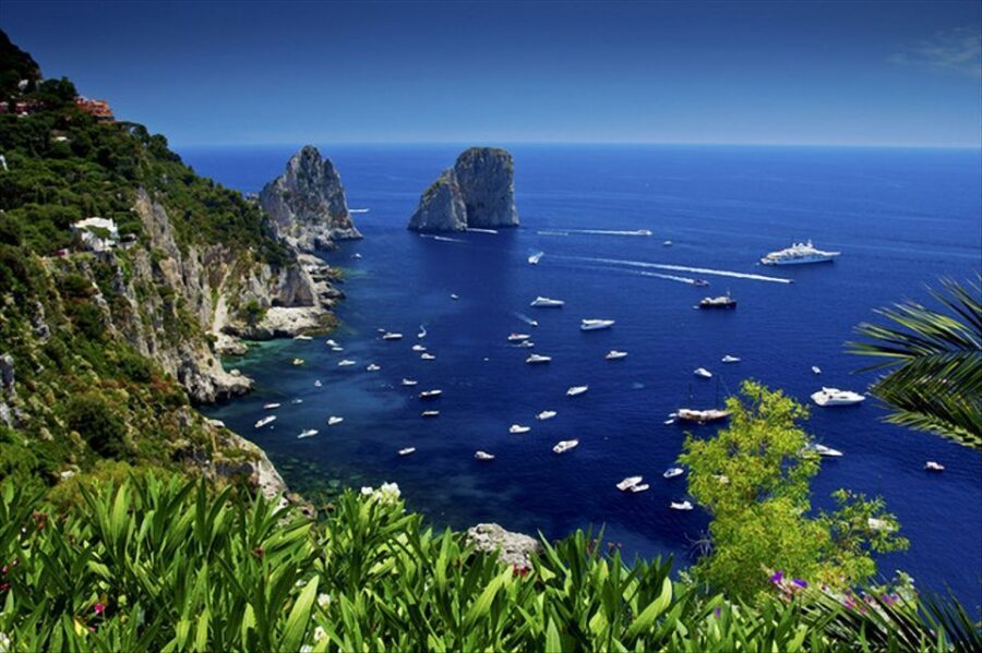 Capri: Day & Night Boat Tour - The cruise portion: coastline views, grottoes, and the Faraglioni Rocks