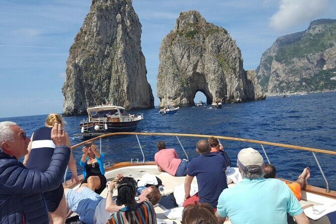 Capri Deluxe: First to Blue Grotto/Boat Ride Options from Naples - 2 Hours on a Wooden Boat: Grottos, Faraglioni, and Calm-Water Moments