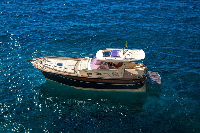 Capri: discover the beauties of the island aboard a Luxury Boat - Faraglioni from the sea: your best photo line