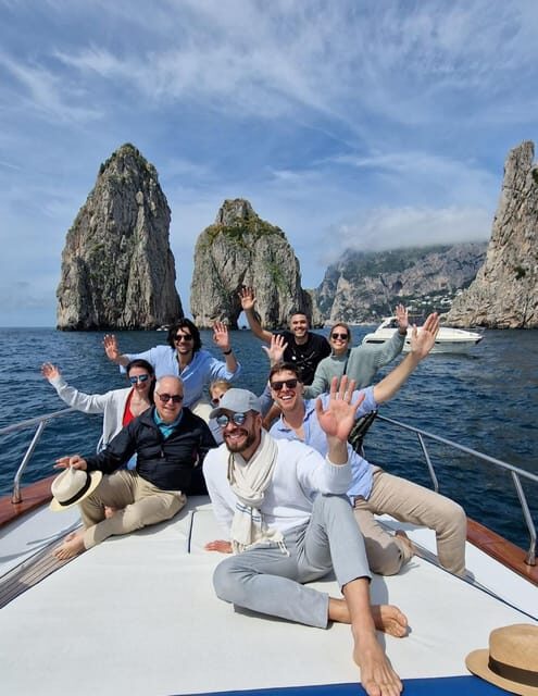 Capri: Exclusive Boat Tour of Hidden Gems with Swimming - What you truly get on board: boat, guide, towels, masks, and drinks