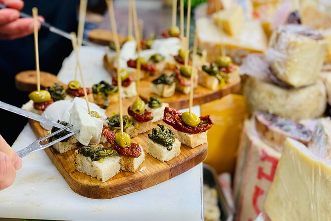 Flavors of Naples Decumani Street Food and Sightseeing Tour - Start at Piazza Bellini: the student energy and the Greek Walls feel