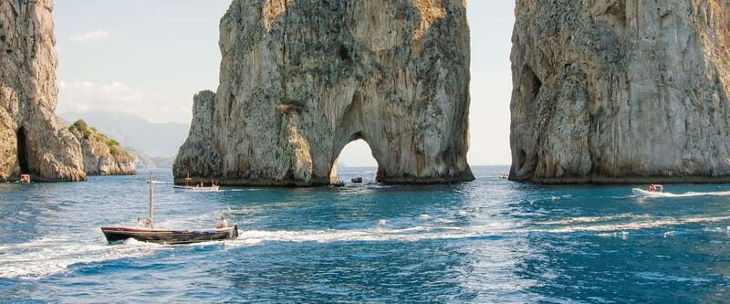 From Naples: Complete Capri Guided Boat and Bus Tour - Capri center and Augustus Gardens: the classic views, with a plan