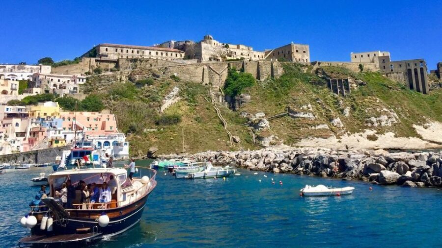 From Sorrento: Ischia and Procida Boat Tour with Snorkeling - Ischia from the sea: castle and beach views before you land