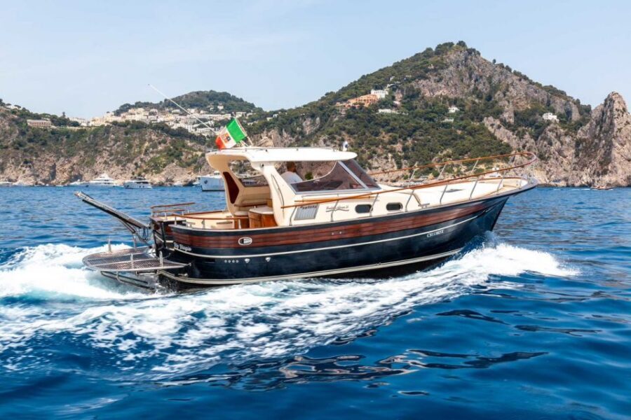 From Sorrento: Positano and Amalfi Coast Private Day Cruise - Passing Praiano and classic cliffside village views