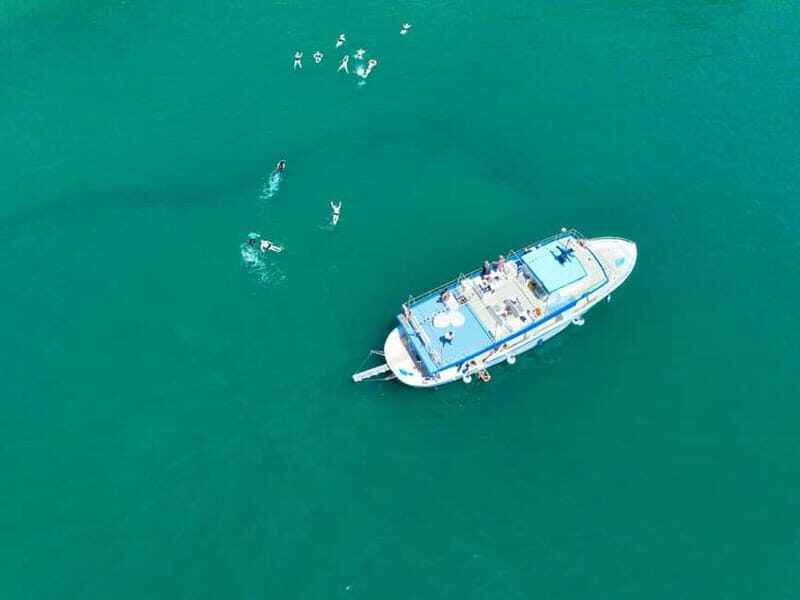 Ischia: Boat tour with swimming stops and lunch on board - Coastal views that come fast after leaving the port