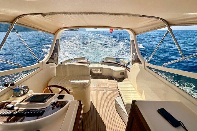 Luxury private boat tour to Capri and Blue Grotto on Gozzo 32 ft - Stop 2: Blue Grotto, the rowboat entrance, and the extra cost