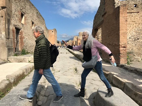 Pompeii Small Group Tour - Tickets Included - Walking the UNESCO ruins: theaters, temples, baths, and more