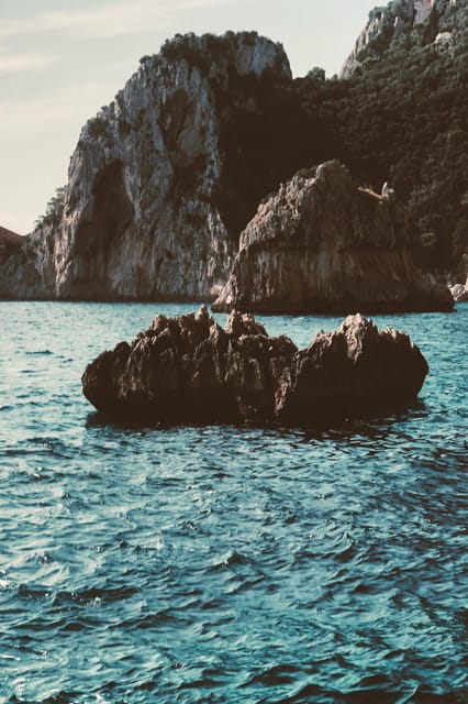 Positano: Capri and Blue Grotto Shared Boat Tour with Drinks - Limoncello Tasting and the Return to Positano