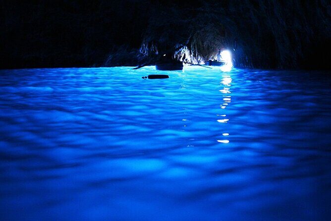 Private Boat Tour of Capri and the Blue Grotto in One Day - I Faraglioni: swimming and sailing under Capri’s natural arch