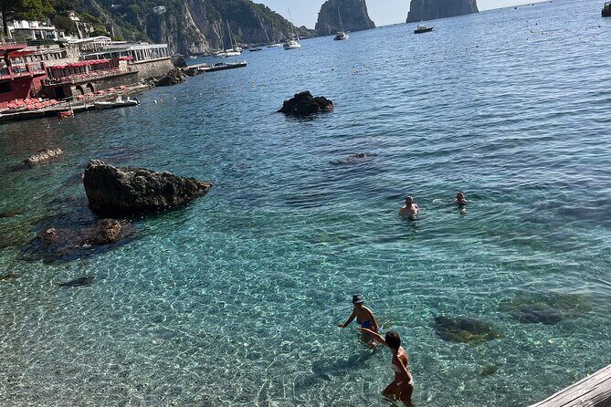 Private Boat Tour of Capri, Positano, Amalfi - Capri by boat: swim stop, sea caves, and the Faraglioni pass