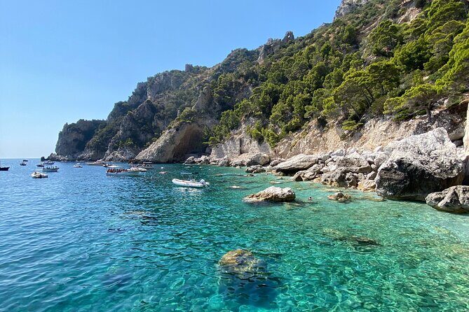 Private boat trip to Capri - Faraglioni di Capri: The Close Pass You Actually Want