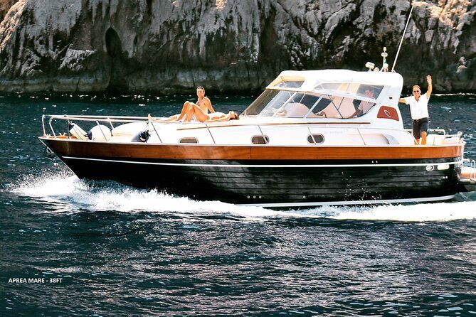 Private Full Day Capri Tour by Boat from Positano - Capri circumnavigation: Faraglioni and Punta Carena from the water