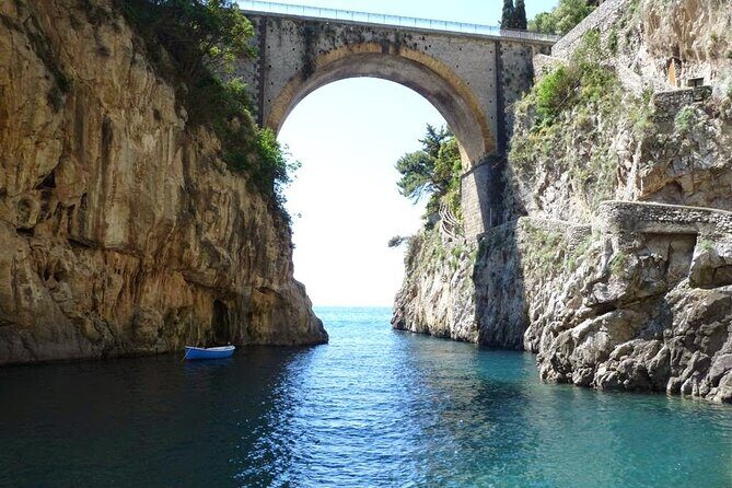 Private full day tour by boat along Positano and Amalfi - Erchie tower: quiet rocks, calm water, and a well-preserved structure