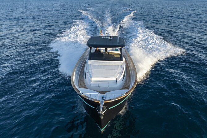 Private Ischia Boat Tour from Positano: Full Day Trip - Baia di San Montano and Punta Imperatore: calm water and dramatic headlands