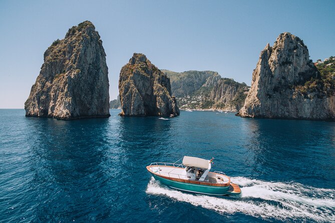 Shared half-day boat tour to Capri from Sorrento - Landmark viewing from the water: Faraglioni, Malaparte, and Punta Carena