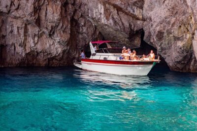 Small Group Boat Day Excursion to Capri Island from Amalfi - Scenic cruise stops: Natural Arch, Faraglioni, and Punta Carena