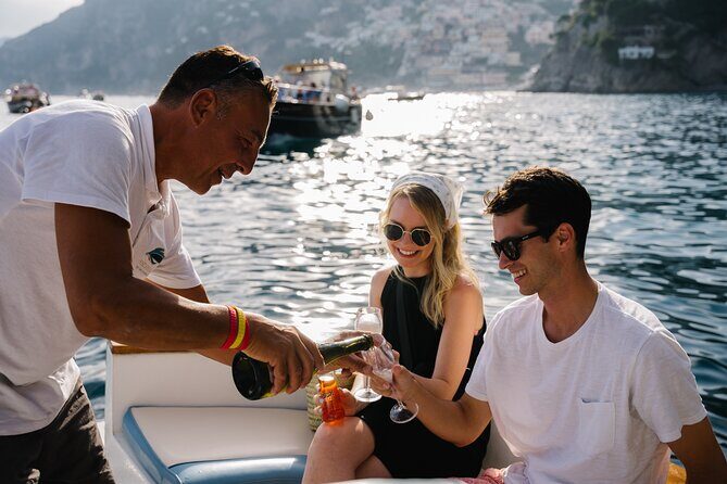 Small Group Tour in Positano by Boat at Sunset with Prosecco - Onboard setup: Prosecco, towels, music, and real convenience