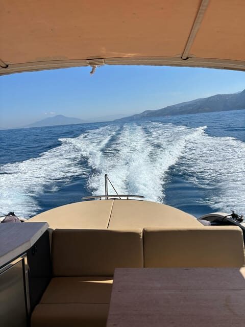 Sorrento: Amalfi Coast Full-Day Boat Tour with Limoncello - Positano 1.5 hours: shops, sandals, and the Lover’s Rock look