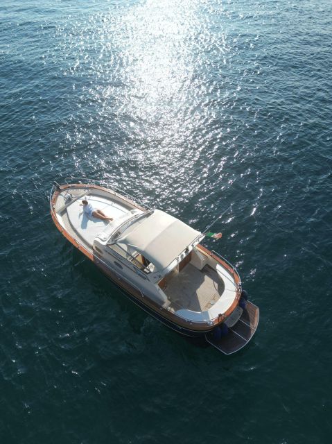 Sorrento: Luxury Private boat to Capri & visit Blue Grotto - Regina Giovanna baths, Saracen defense tower, and a natural waterfall stop