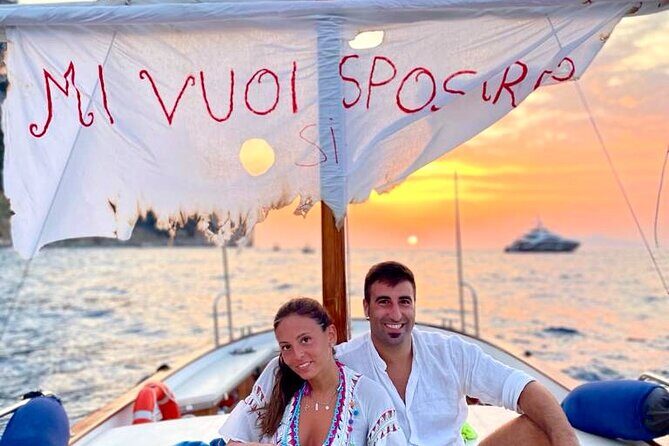 Sunset & Aperitif Boat tour - Stop near Faraglioni: caves, the famous rocks, and a proper swim break