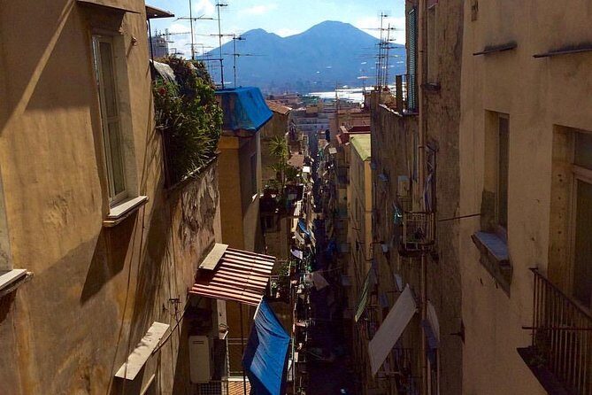 Visit of the Historic Center of Naples with an Expert Guide - Ancient tuff walls and a quick listen outside San Pietro a Majella